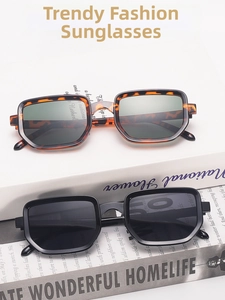 Detail view of square vintage sunglasses in tortoiseshell and black on magazine