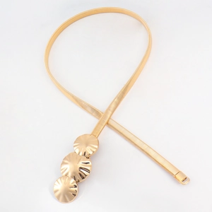 Detail of golden elastic waist chain with three textured circular metal buckles on white background
