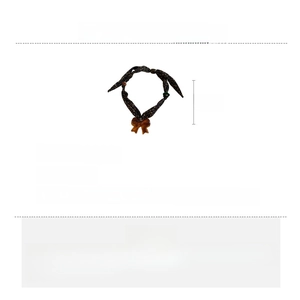 Detail view showing 80cm brown fabric chain with amber acrylic bow pendant necklace