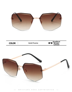 Close-up of frameless polygon sunglasses with gold metal bridge and tea gradient lenses