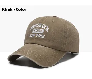 Detailed close-up of khaki cotton baseball cap with white Brooklyn 1631 embroidery