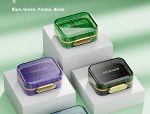Multi-colored transparent pill organizers with independent compartments and secure metal clasps