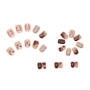 Caramel brown press-on nails with cute bear patterns and amber marble designs