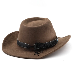 Detail of brown cowboy hat with crocodile pattern band and turquoise stone embellishments