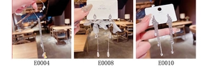 Detailed view of silver bow and moon fringe earrings with S925 sterling silver hallmarking