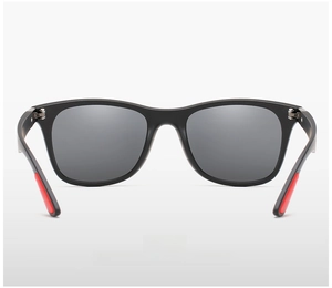 Detail view of matte black polarized sunglasses with anti-slip red rubber temple tips