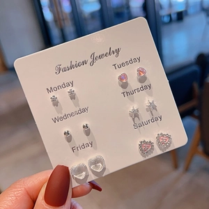 Set of six fresh style stud earrings featuring heart and bow designs on a display card
