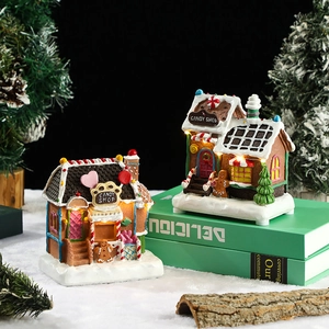 Luminous Christmas gingerbread house figurines with LED warm glow and resin craft details