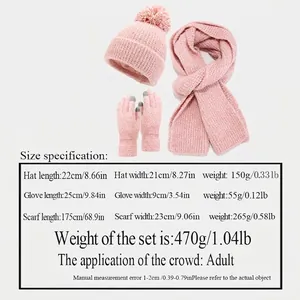 Winter 3-piece pink knitted set including hat with pom-poms, scarf, and gloves
