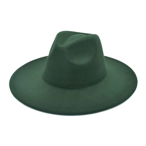 Detailed view of dark green wool fedora hat showing textured felt fabric and wide brim