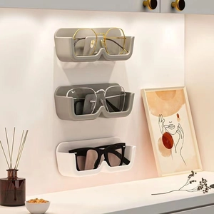 Wall-mounted eyewear storage rack for sunglasses and glasses in minimalist grey and white