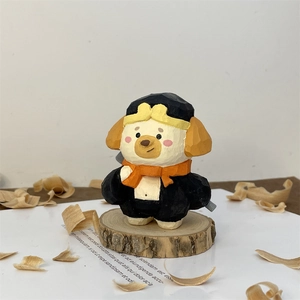 Detailed macro view of a hand-carved wooden cartoon animal figurine for desktop decor