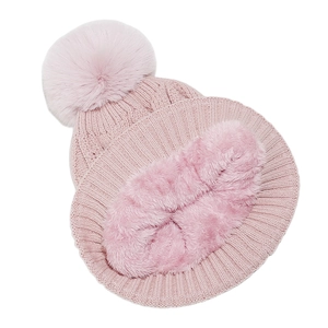 Detail of pink knitted winter beanie with faux fur pom-pom and matching fleece-lined neck warmer