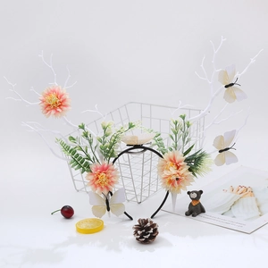 Detailed shot of double velvet rose hair clip with aesthetic forest-themed props