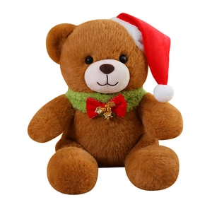 Brown Christmas Teddy Bear plush with red Santa hat and green knitted scarf on white background