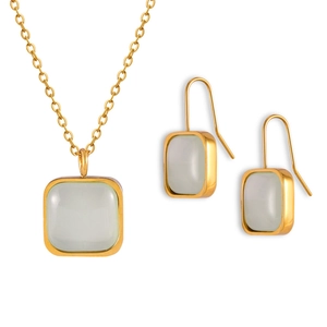 Minimalist gold metal necklace and earrings set with translucent green square stones