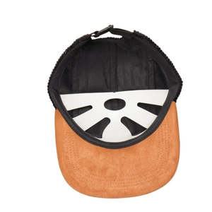 Detail view of corduroy and suede flat brim hat with breathable mesh lining and buckle