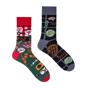 Detail of creative BBQ themed asymmetric mid-calf cotton socks with grill and food patterns