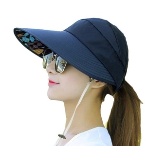 Navy blue sun visor for women with floral leaf print lining and white windproof strap