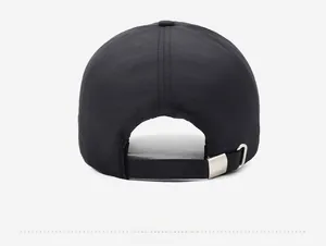 Detail of adjustable metal buckle with FARD engraving on back of black baseball cap