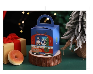 Macro detail of dark blue Christmas gift box with cat illustration and sturdy handle