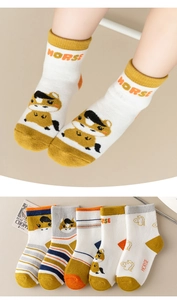 Macro detail of five pairs of cotton knit horse cartoon socks in yellow and grey colors