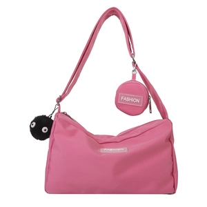 Pink nylon hobo crossbody bag with adjustable strap and small zipper pouch attachment