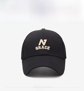 Detailed close-up of a black mesh baseball cap with 3D beige N GRACE embroidery