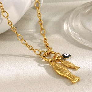 Close-up of 18K gold-plated irregular chain necklace with fish pendants and spring clasp
