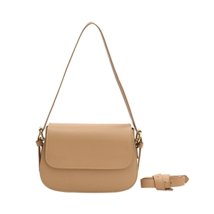 Retro camel leather saddle bag for women featuring a minimalist flap and crossbody strap