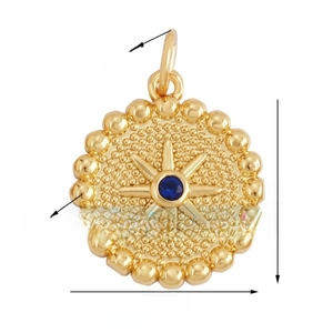 Detail showing a gold sunburst disc pendant with a blue gemstone center and beaded edge