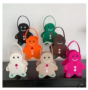 Colorful gingerbread man felt tote bags in various colors on a display stand