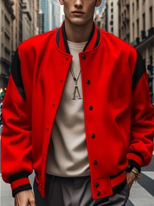 Detail of red and black varsity jacket featuring striped cuffs and high-quality fabric