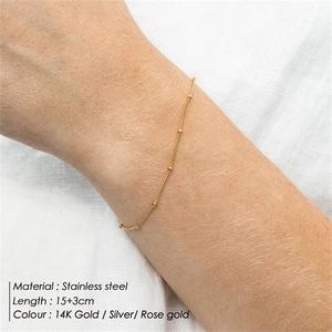 Close-up of gold stainless steel bead chain bracelet 15+3cm on female wrist