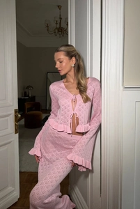 Detailed knit texture of pink hollow-out lace-up top and matching skirt set
