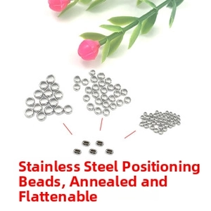 Macro detail of annealed stainless steel crimp beads for DIY jewelry making