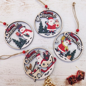 Set of 4 laser-cut wooden Christmas ornaments with Santa, Snowman and Reindeer motifs