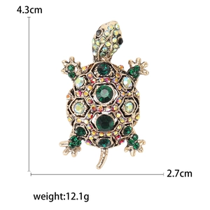 Fashionable vintage turtle brooch with colorful rhinestones on a gold metal base