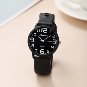 Close-up of black silicone quartz watch dial with large white numerical scales