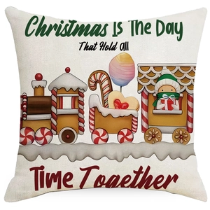 Detail of Christmas pillow cover featuring gingerbread train and festive holiday elements