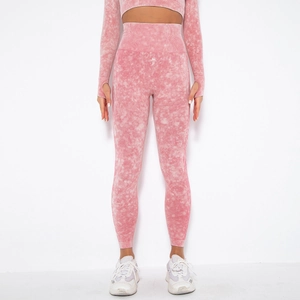 Detail showing pink seamless marble wash knit fabric and thumb hole cuffs on sports top