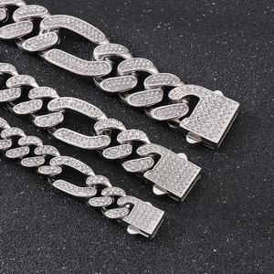 Macro shot of silver hip-hop curb chains with pavé rhinestones in three widths