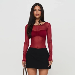 Detail of red sheer mesh long sleeve bodysuit with slim fit design and transparent fabric