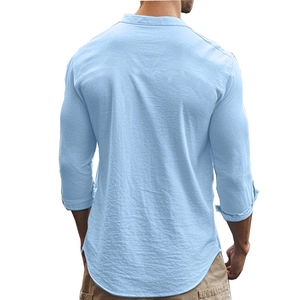 Detail view of light blue slim-fit casual cotton shirt showing back design and curved hem
