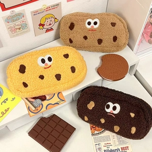 Detailed view of plush cookie-shaped pencil cases in three colors with soft teddy fleece texture