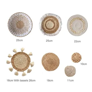 Handwoven bohemian straw wall decor set with natural fiber textures and fringe accents