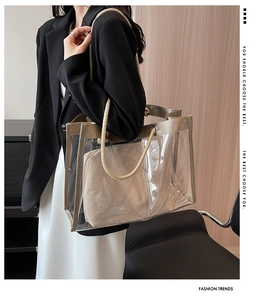Close-up of transparent PVC tote bag with beige inner pouch and woven rope handle