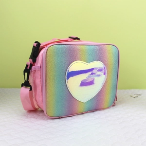 Detail of glitter rainbow lunch bag featuring a holographic heart and side mesh pocket