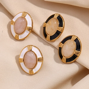 Detailed close-up of retro oval stud earrings with 18K gold plating and natural stone