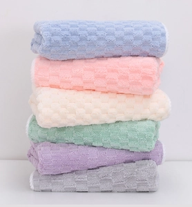 Detailed stack of six colorful waffle-weave microfiber towels in soft macaron shades